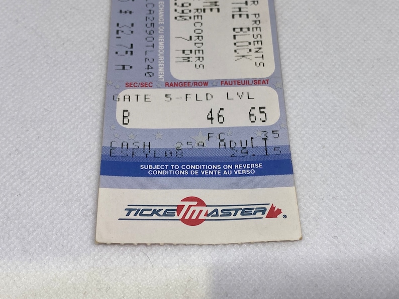 May include: A blue and white ticket for a concert featuring The Recorders at The Block. The ticket is for Gate 5, Field Level, Row 46, Seat 65. The ticket is for August 29th at 7:00 PM. The ticket is subject to conditions on the reverse side.