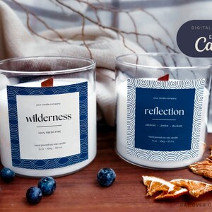 Two glass jars with DIY candle labels photographed on a cozy background. Left candle has a dark blue wave drawing frame. Right candle has a white frame with tidal pool drawing frame. Candle name is in sans serif. Digital download edit with Canva