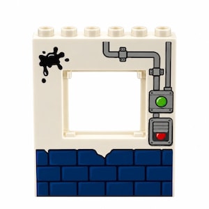 May include: A white plastic building block with a square cutout, featuring a blue brick pattern at the base, a black ink splatter graphic on the left, and a grey pipe system on the right with a green button and a red light indicator.
