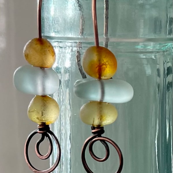 Baltic Sea amber and sea foam Scottish sea glass drop earrings, on oxidized copper ear hooks.