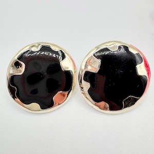 May include: A set of three ceramic nesting bowls in graduating sizes. The bowls feature a speckled, matte finish in shades of cream, light brown, and dark brown. The largest bowl is approximately 7 inches in diameter.