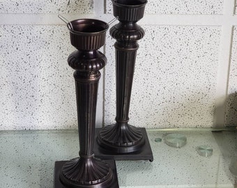 large pair of solid brass candlesticks, brown colors.