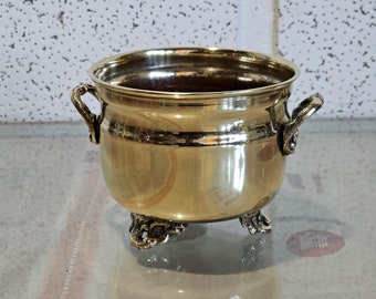 solid brass flowerpot, solid brass flowerpot cache. Vintage brass planter pot with (3) soleplates and (2) handles shiny aged patina.