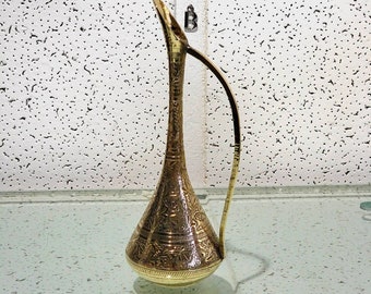 antique hand-engraved brass vase .