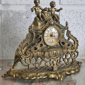 Old mantel clock, table mantel clock, very heavy solid brass mantel clock. rare antique.