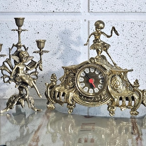 Old mantel clock and three branch candlestick, table mantel clock, heavy solid brass mantel clock and candlestick .antique