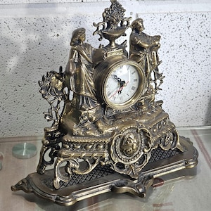 Old mantel clock, table mantel clock, very heavy solid brass mantel clock. rare antique.
