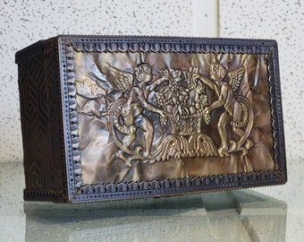 vintage jewelry box or storage chest in wood carved on brass cherub, antique jewelry box.