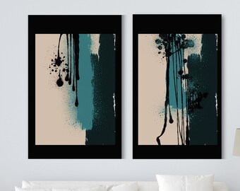May include: Two abstract art prints featuring black, teal and beige paint splatters and brushstrokes. The prints are framed in black and hung on a white wall.