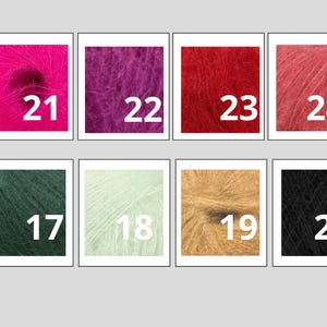 May include: A collection of eight vibrant yarn samples, each displayed in a square frame. The colors include shades of pink, purple, red, and peach, along with green, light green, tan, and black. Each sample is labeled with a white number.