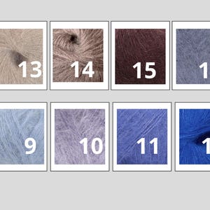 May include: A collection of eight yarn samples in various colors, each labeled with a number. Colors include shades of beige, brown, purple, blue, and gray. The yarn appears soft and fluffy, ideal for knitting or crochet projects.