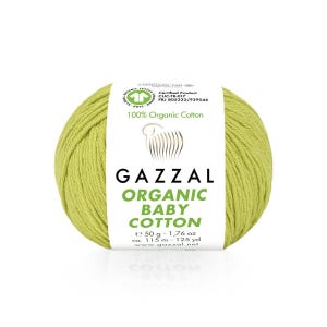 May include: A ball of light green Gazzal Organic Baby Cotton yarn. The label reads "100% Organic Cotton" and includes details about the yarn weight, which is 50 g, and length, which is 115 m - 125 yd. The yarn is certified by GOTS.