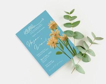 May include: A light blue wedding invitation with white calligraphy text announcing the marriage of Hayan and Ismail. The invitation features a floral design with yellow flowers on a blue background. The text includes the date of the wedding, March 25th, 2025, and the location, Solar Garden, Basksewa, NSW.