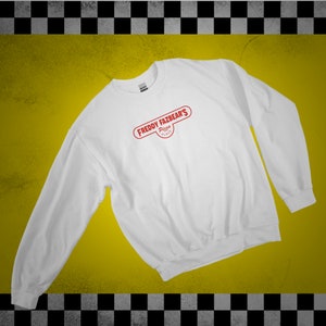 May include: White sweatshirt with a red logo that says "Freddy Fazbear's Pizza Place" on the front.