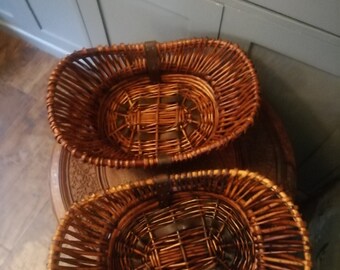 Pair of wicker hamper baskets, no handles, brown leather reinforcing straps 16! x 11" x 4"