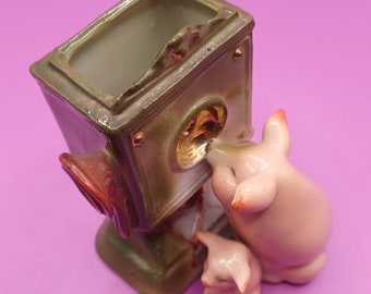 Vintage Fairing pigs, sow & piglet at telephone