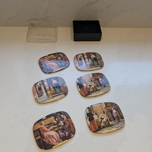 May include: A set of six square coasters with rounded corners, each featuring a different historical interior scene with figures in period clothing. The coasters are accompanied by a clear plastic lid and a black storage box.