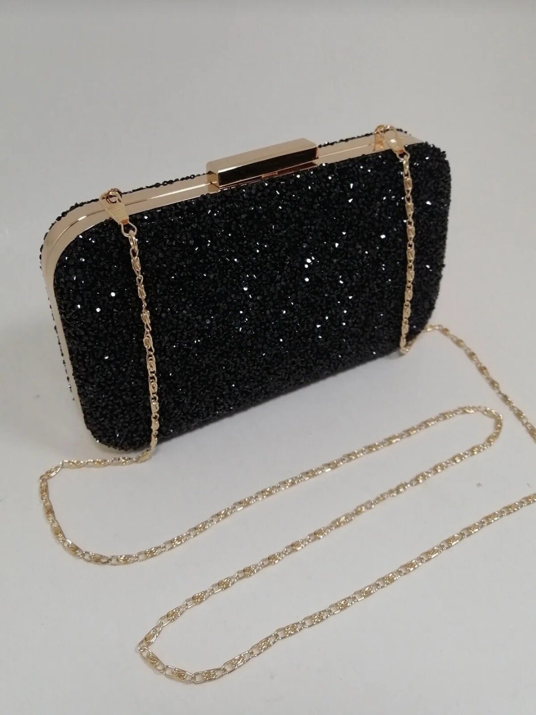 Black glitter online clutch bag
