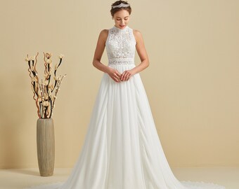 High-neck boho wedding dress with slightly falling and embroidered lace on the Ebony skirt