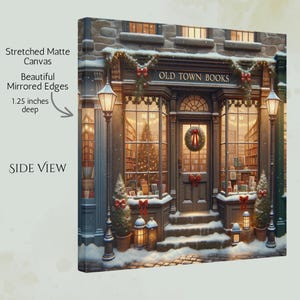 May include: A stretched matte canvas print of a bookstore storefront titled OLD TOWN BOOKS, featuring a snowy exterior with holiday wreaths, red bows, and lit lanterns. The canvas has mirrored edges and is 1.25 inches deep, shown from a side view.