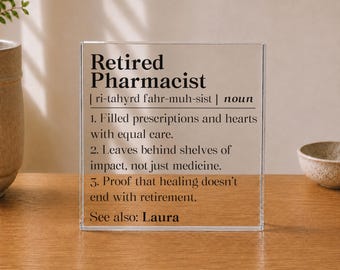 May include: A clear acrylic block sign featuring black printed text that defines a Retired Pharmacist as someone who filled prescriptions and hearts with care, leaves behind shelves of impact, and proves healing continues. It includes the name Laura.