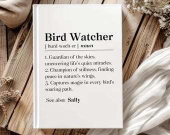 May include: A white book with the title "Bird Watcher" and a definition. The book is on a wooden surface with decorative elements. The definition includes three points about bird watching and a reference to "Sally".