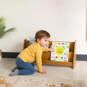 We combine Large Toddler Montessori Bookshelf and Mid Century style Modern Book Shelf Kids Room Montessori Furniture. Here is Wooden Low Nursery Bookcase, Baby Book Box! This large toddler shelf can be best gift from family to new baby boy or girl, toddler or kids. This toddler bookcase will be perfect matches with her or him toddler furniture. Unique design montessori bookcase will be perfect gift as a nursery book shelves and kids room bookcase.