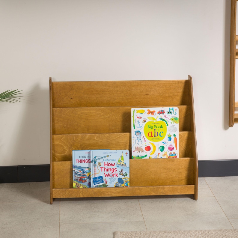 We combine Large Toddler Montessori Bookshelf and Mid Century style Modern Book Shelf Kids Room Montessori Furniture. Here is Wooden Low Nursery Bookcase, Baby Book Box! This large toddler shelf can be best gift from family to new baby boy or girl, toddler or kids. This toddler bookcase will be perfect matches with her or him toddler furniture. Unique design montessori bookcase will be perfect gift as a nursery book shelves and kids room bookcase.