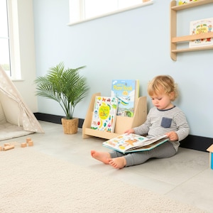 We combine Large Toddler Montessori Bookshelf and Mid Century style Modern Book Shelf Kids Room Montessori Furniture. Here is Wooden Low Nursery Bookcase, Baby Book Box! This large toddler shelf can be best gift from family to new baby boy or girl, toddler or kids. This toddler bookcase will be perfect matches with her or him toddler furniture. Unique design montessori bookcase will be perfect gift as a nursery book shelves and kids room bookcase.
