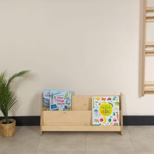 Montessori Bookshelf for Kids 📚

Low Baby Book Box – Nursery Bookcase with Front-Facing Shelves for Toddlers

Encourage your child’s love for reading with this beautifully handcrafted Montessori Bookshelf! Designed at the perfect height for toddlers, this front-facing bookcase allows little readers to easily see and choose their favorite stories — promoting independence, organization, and a love of books from an early age.