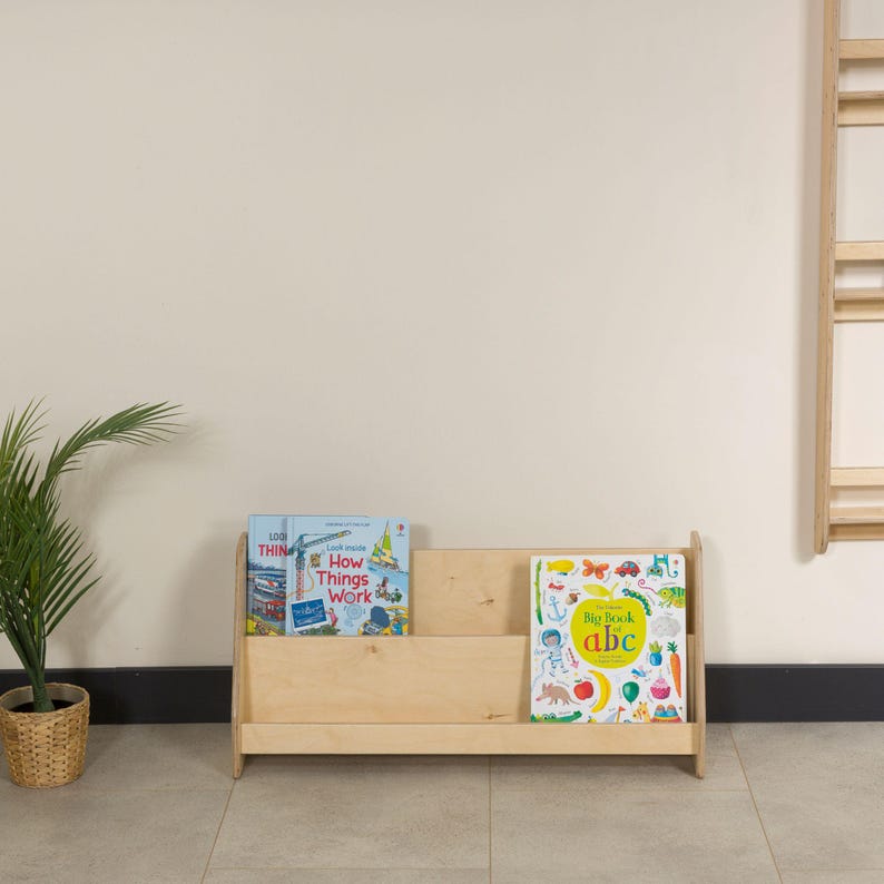 Montessori Bookshelf for Kids 📚

Low Baby Book Box – Nursery Bookcase with Front-Facing Shelves for Toddlers

Encourage your child’s love for reading with this beautifully handcrafted Montessori Bookshelf! Designed at the perfect height for toddlers, this front-facing bookcase allows little readers to easily see and choose their favorite stories — promoting independence, organization, and a love of books from an early age.