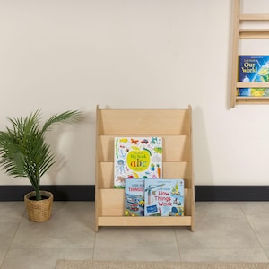 We combine Large Toddler Montessori Bookshelf and Mid Century style Modern Book Shelf Kids Room Montessori Furniture. Here is Wooden Low Nursery Bookcase, Baby Book Box! This large toddler shelf can be best gift from family to new baby boy or girl, toddler or kids. This toddler bookcase will be perfect matches with her or him toddler furniture. Unique design montessori bookcase will be perfect gift as a nursery book shelves and kids room bookcase.
