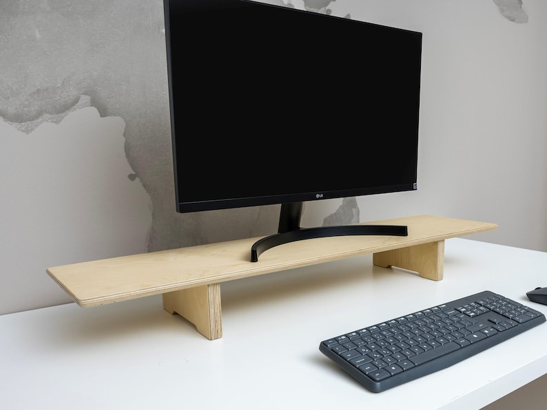 Transform your workspace with our Adjustable Dual Monitor Stand, designed for ergonomic comfort and functionality. Ideal for those who spend extended hours in front of the computer, this monitor riser alleviates back and neck pain