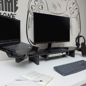 Dual Monitor Stand Riser with Drawer – Wooden Laptop Organizer & Desk Setup Shelf 🌿

Upgrade your workspace with our dual monitor stand riser, designed by the Wood and Science Team. This wooden desk organizer combines practicality, safety, and customization, making it perfect for home offices, gamers, and creative professionals.