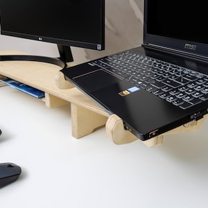 Transform your workspace with our Adjustable Dual Monitor Stand, designed for ergonomic comfort and functionality. Ideal for those who spend extended hours in front of the computer, this monitor riser alleviates back and neck pain