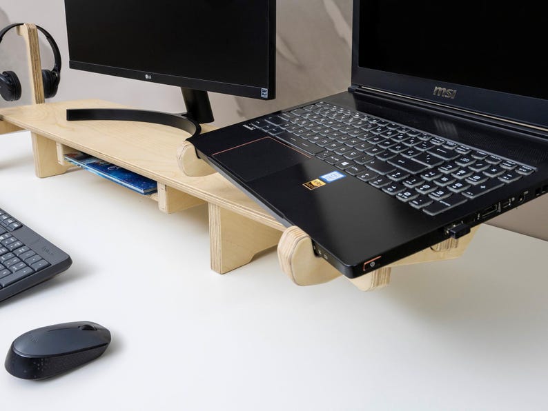 Transform your workspace with our Adjustable Dual Monitor Stand, designed for ergonomic comfort and functionality. Ideal for those who spend extended hours in front of the computer, this monitor riser alleviates back and neck pain