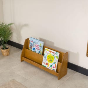 We combine Large Toddler Montessori Bookshelf and Mid Century style Modern Book Shelf Kids Room Montessori Furniture. Here is Wooden Low Nursery Bookcase, Baby Book Box! This large toddler shelf can be best gift from family to new baby boy or girl, toddler or kids. This toddler bookcase will be perfect matches with her or him toddler furniture. Unique design montessori bookcase will be perfect gift as a nursery book shelves and kids room bookcase.