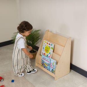 Montessori Bookshelf for Kids 📚

Low Baby Book Box – Nursery Bookcase with Front-Facing Shelves for Toddlers

Encourage your child’s love for reading with this beautifully handcrafted Montessori Bookshelf! Designed at the perfect height for toddlers, this front-facing bookcase allows little readers to easily see and choose their favorite stories — promoting independence, organization, and a love of books from an early age.