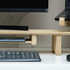 Transform your workspace with our Adjustable Dual Monitor Stand, designed for ergonomic comfort and functionality. Ideal for those who spend extended hours in front of the computer, this monitor riser alleviates back and neck pain