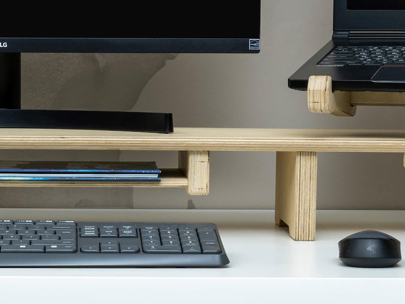 Transform your workspace with our Adjustable Dual Monitor Stand, designed for ergonomic comfort and functionality. Ideal for those who spend extended hours in front of the computer, this monitor riser alleviates back and neck pain