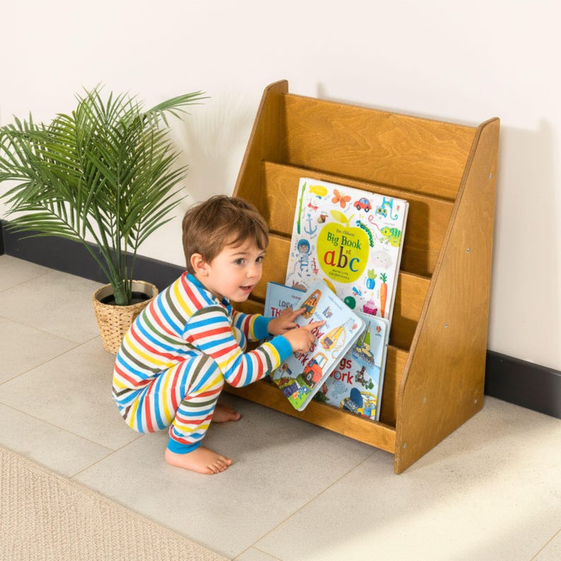 Montessori Bookshelf for Kids 📚

Low Baby Book Box – Nursery Bookcase with Front-Facing Shelves for Toddlers

Encourage your child’s love for reading with this beautifully handcrafted Montessori Bookshelf! Designed at the perfect height for toddlers, this front-facing bookcase allows little readers to easily see and choose their favorite stories — promoting independence, organization, and a love of books from an early age.