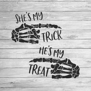 May include: Black and white graphic design with two skeleton hands. The top hand is pointing to the text "She's my trick" and the bottom hand is pointing to the text "He's my treat".