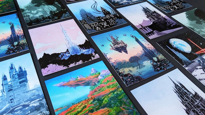 May include: A collection of 12 fantasy landscape art prints featuring a variety of scenes, including castles, towers, and floating islands. The prints are all in a similar style, with a dark background and bright colours.