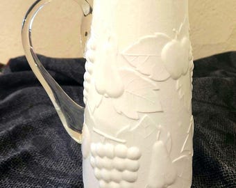 Milk Glass Pitcher with Clear Handle and Embossed Fruit