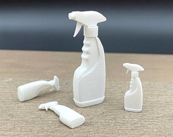 May include: Three white plastic spray bottles of different sizes. The bottles have a trigger spray nozzle and a textured design.
