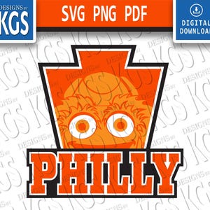 Op de afbeelding: Oranje en zwart grafisch ontwerp met een stripfiguur met grote oranje ogen en een basketbal. Het woord "PHILLY" wordt weergegeven in oranje blokletters met een zwarte omlijning. Het ontwerp bevat de tekst "SVG PNG PDF" en "DIGITALE DOWNLOAD".