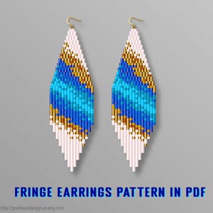 May include: A pair of long, diamond-shaped beaded fringe earrings featuring a gradient pattern of white, gold, light blue, and dark blue glass beads. The earrings hang from gold-toned metal hooks and display a repeating geometric design.