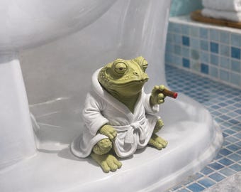 Rana fumadora en el inodoro – Divertida decoración para el baño