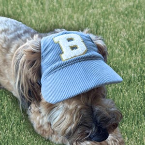 May include: A set of three ceramic mugs with a speckled, matte finish. The mugs are in shades of cream, light gray, and dark gray. Each mug has a simple, minimalist design, perfect for coffee or tea.