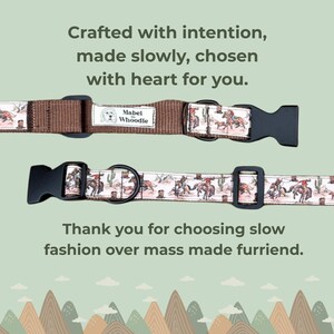 May include: Two dog collars with black plastic buckles. One is brown with a cowboy print, the other is light pink with a cowboy print. The collars have the text "Mabel Whoodle" on a label.